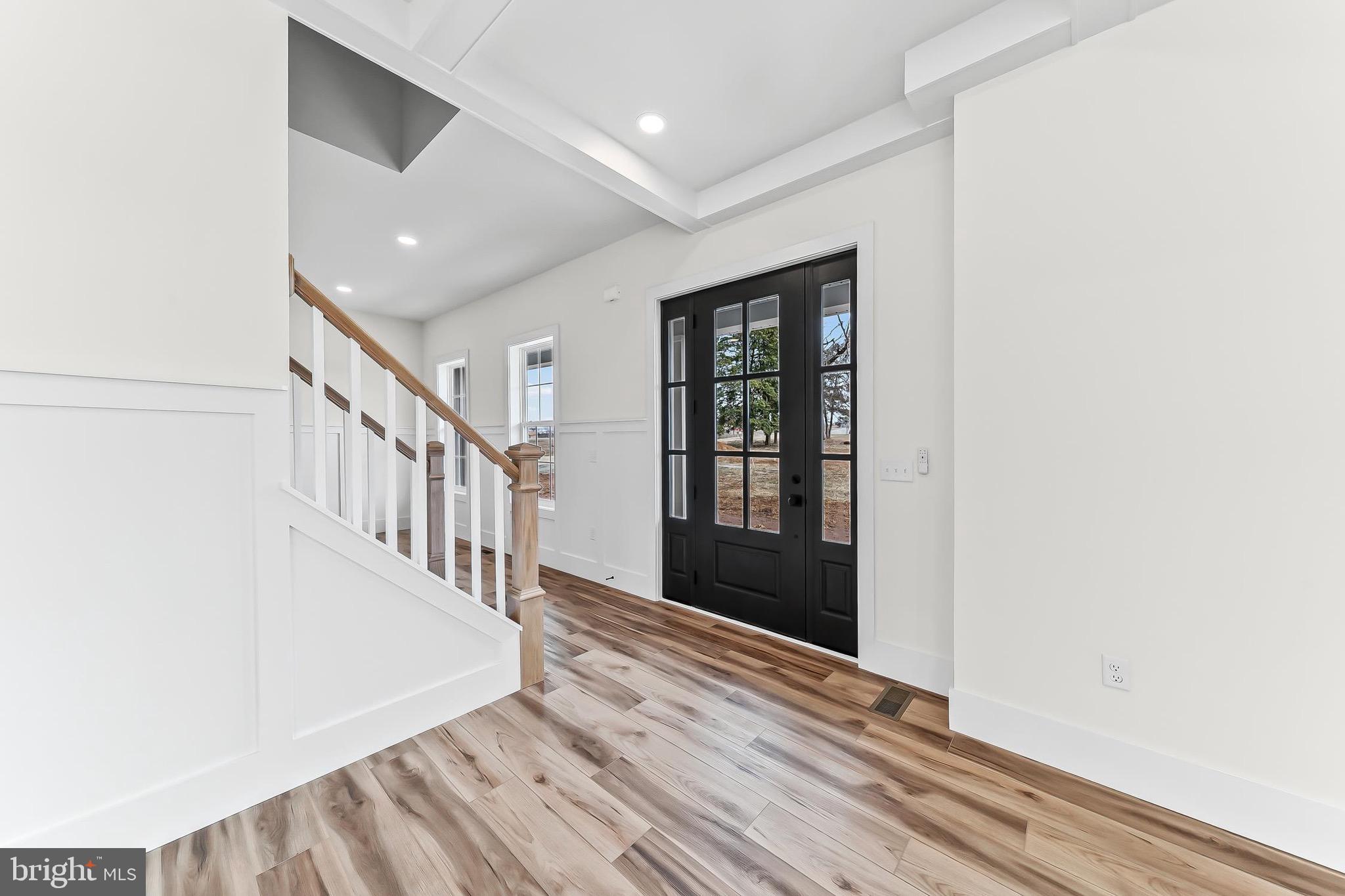 179 Ellicott Road Avondale, PA 19311 - Photo 3 of 65 a view of a hallway with wooden floor and staircase