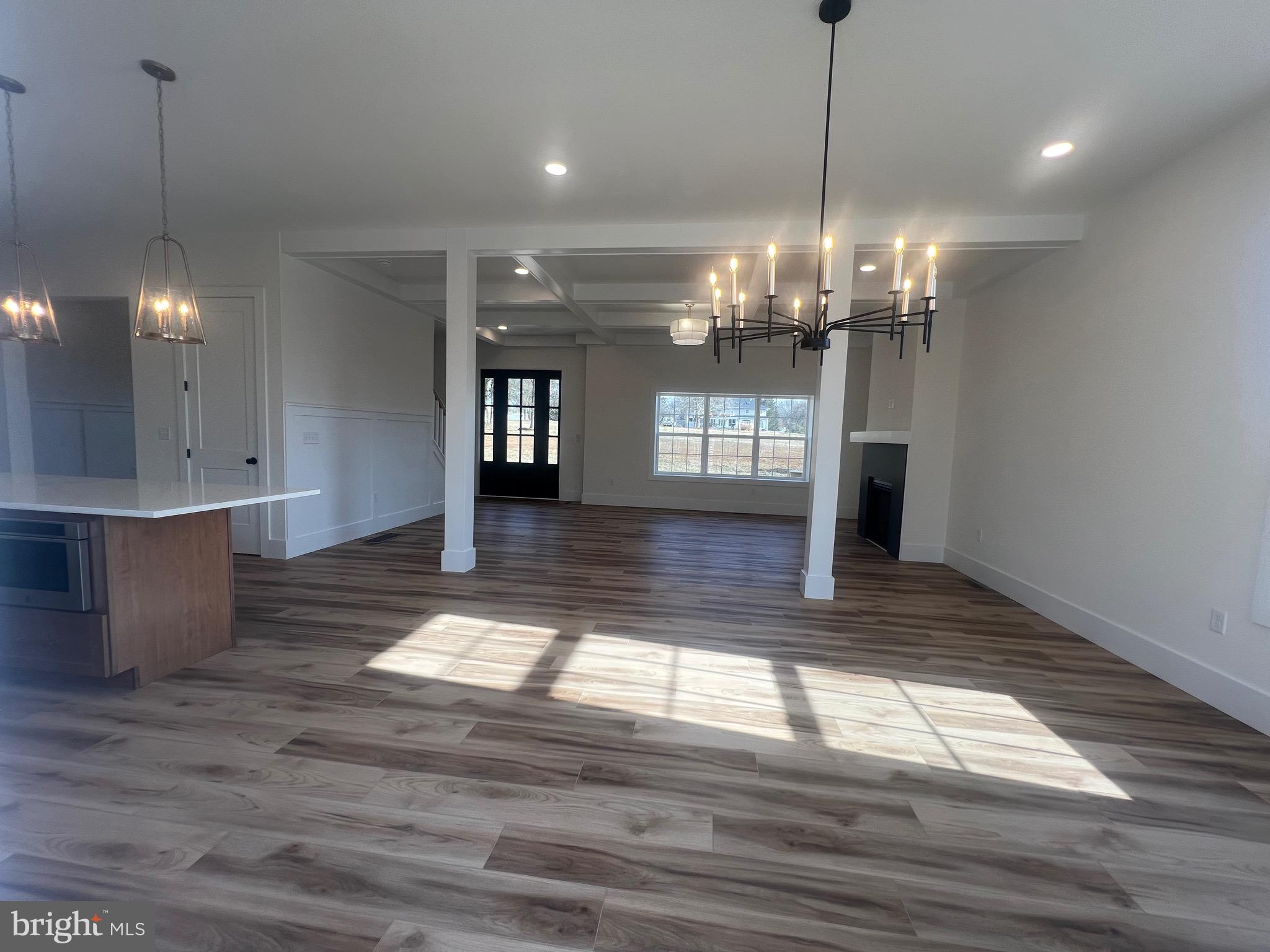 179 Ellicott Road Avondale, PA 19311 - Photo 36 of 65 a view of a room with granite countertop stainless steel appliances lots of wooden floor cabinets and a chandelier