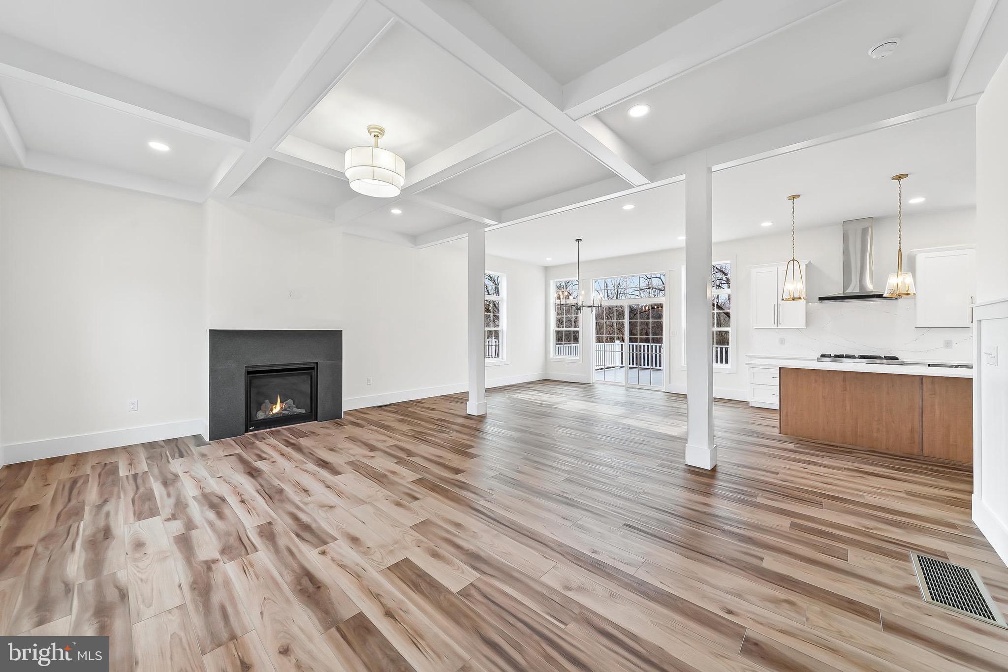 179 Ellicott Road Avondale, PA 19311 - Photo 6 of 65 a view of empty room with wooden floor and fireplace
