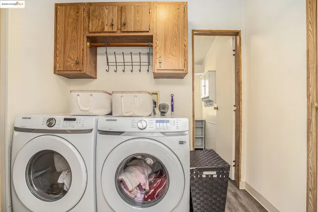 a view of storage and utility room with closet