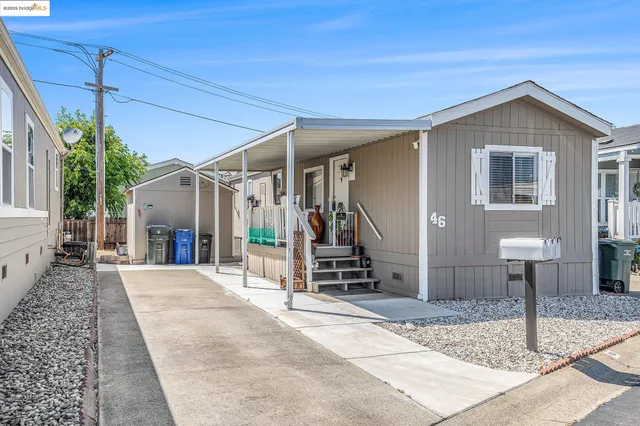 a front view of a house with stairs