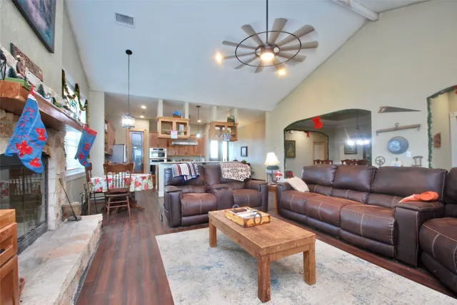 a kitchen with stainless steel appliances a sink a stove and a refrigerator