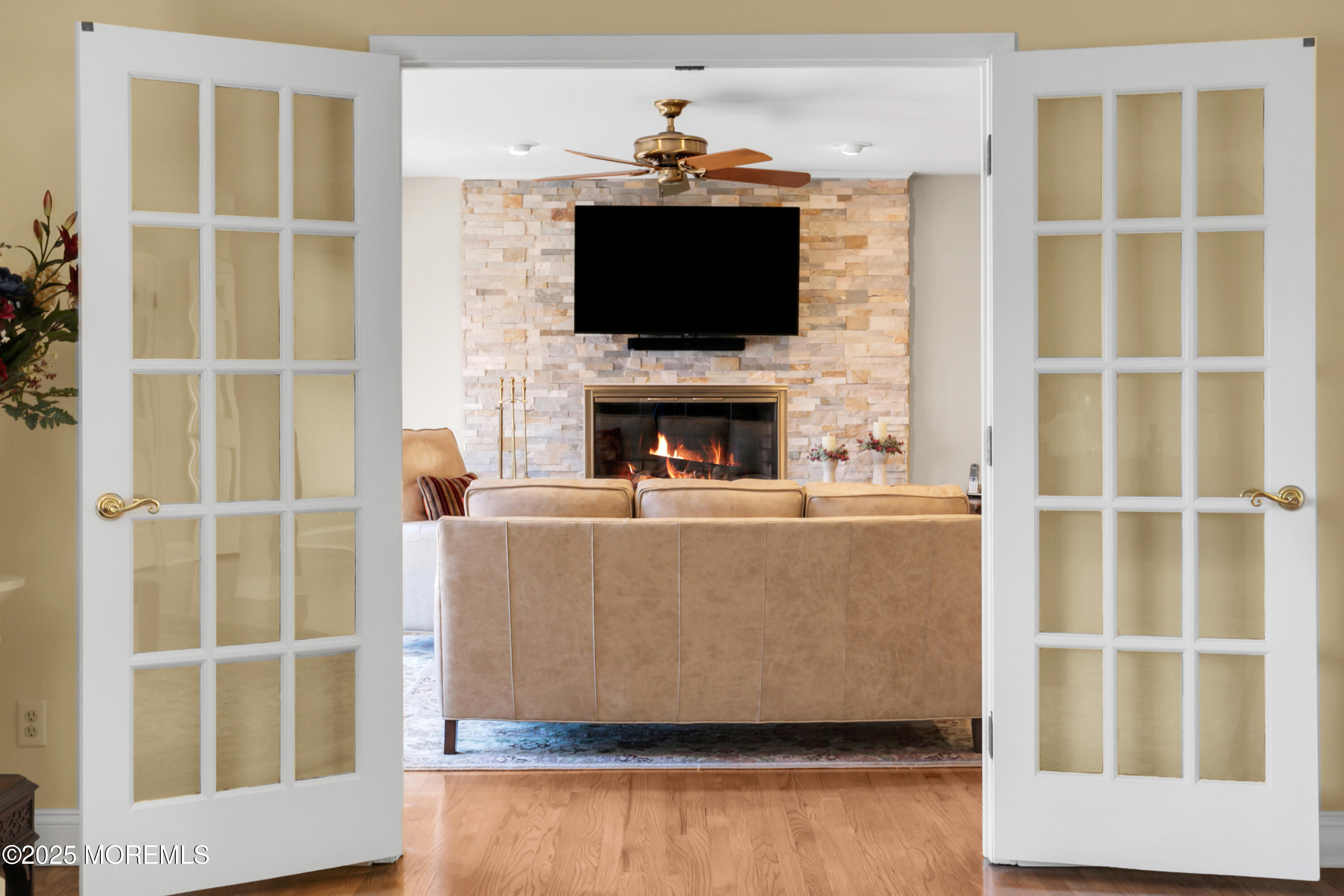 59 Doherty Drive Middletown, NJ 07748 - Photo 13 of 48 a living room with a flat screen tv and a fireplace