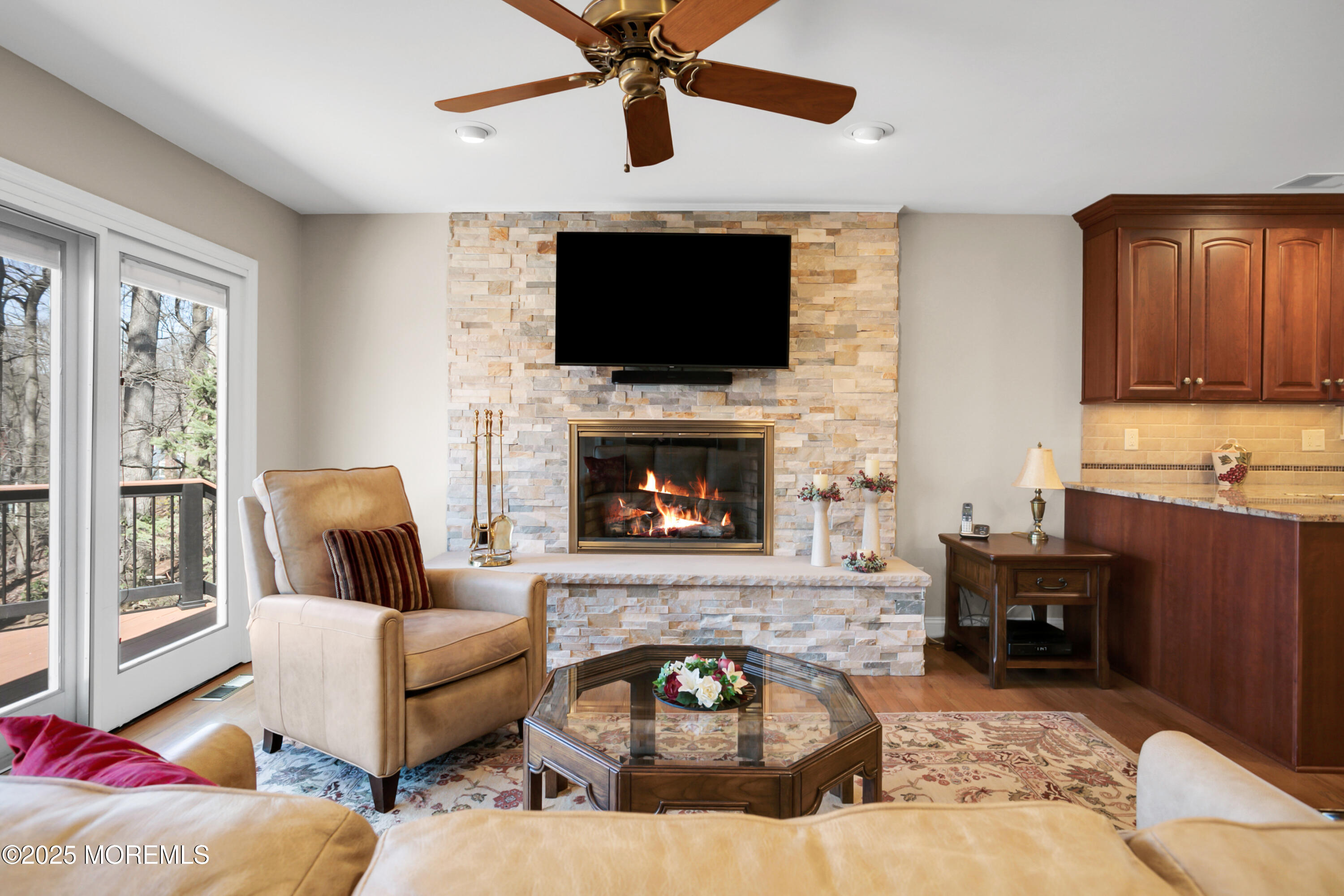 59 Doherty Drive Middletown, NJ 07748 - Photo 14 of 48 a living room with furniture a flat screen tv and a fireplace