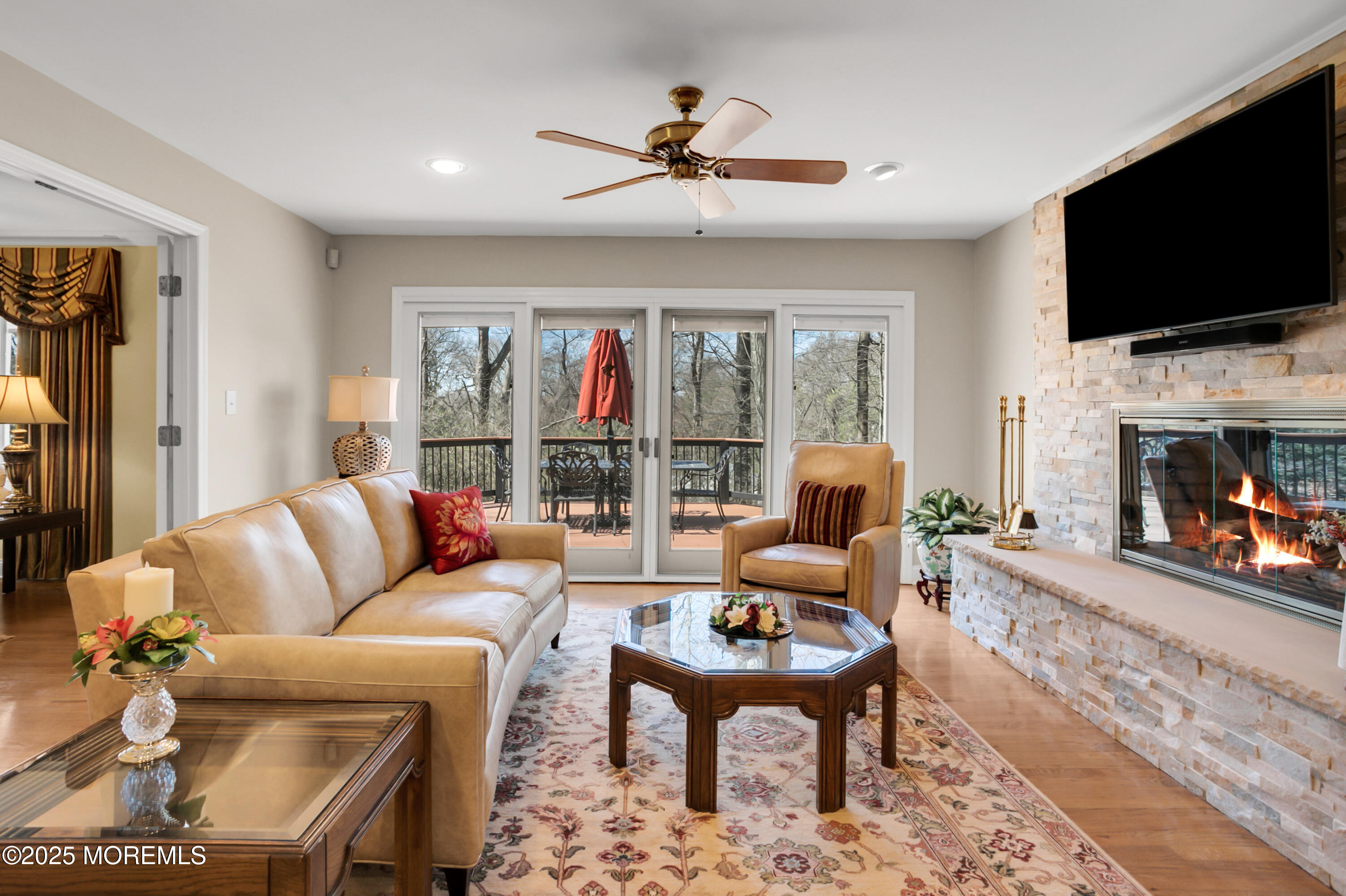 59 Doherty Drive Middletown, NJ 07748 - Photo 15 of 48 a living room with fireplace furniture and a flat screen tv