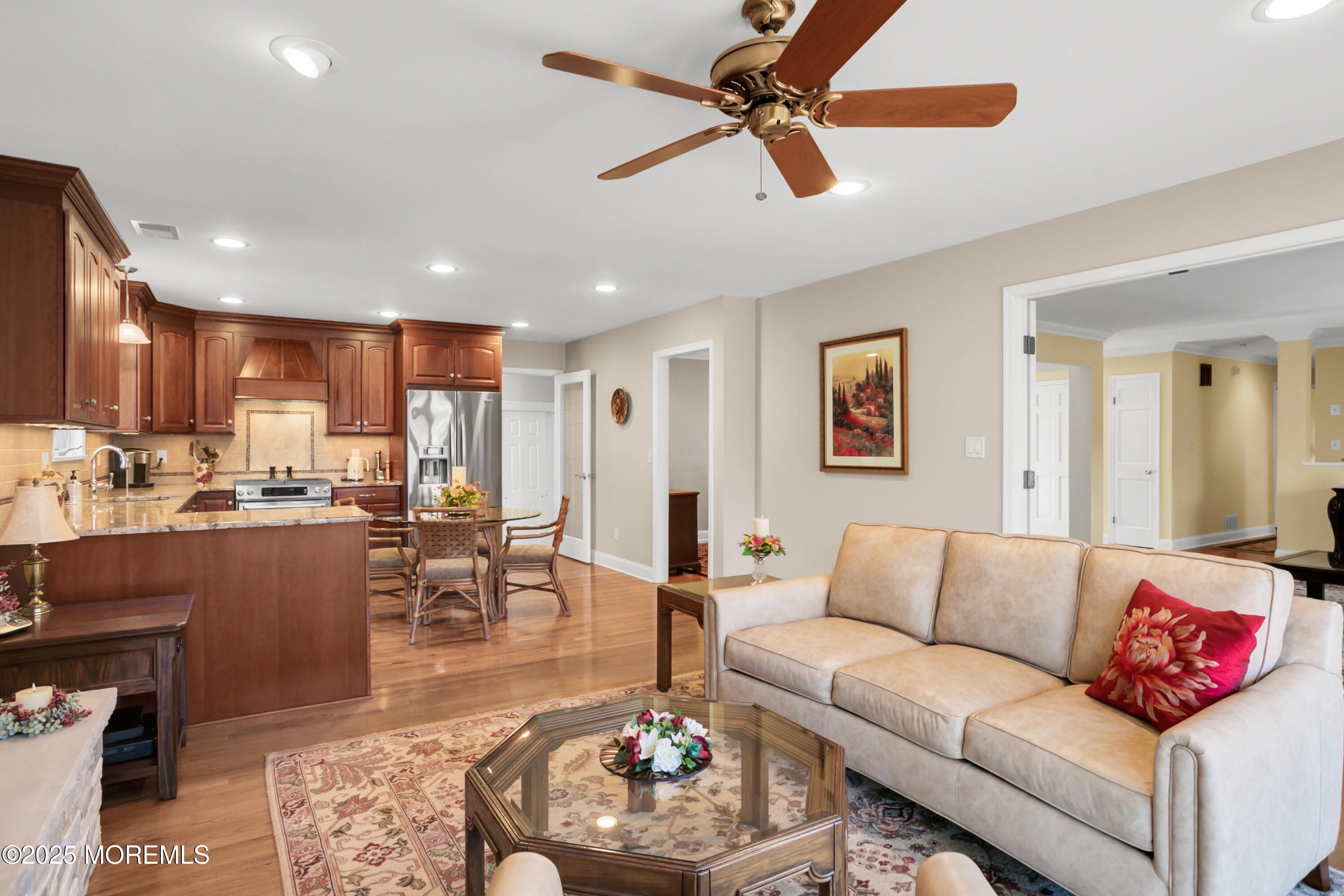 59 Doherty Drive Middletown, NJ 07748 - Photo 16 of 48 a living room with furniture kitchen view and a wooden floor