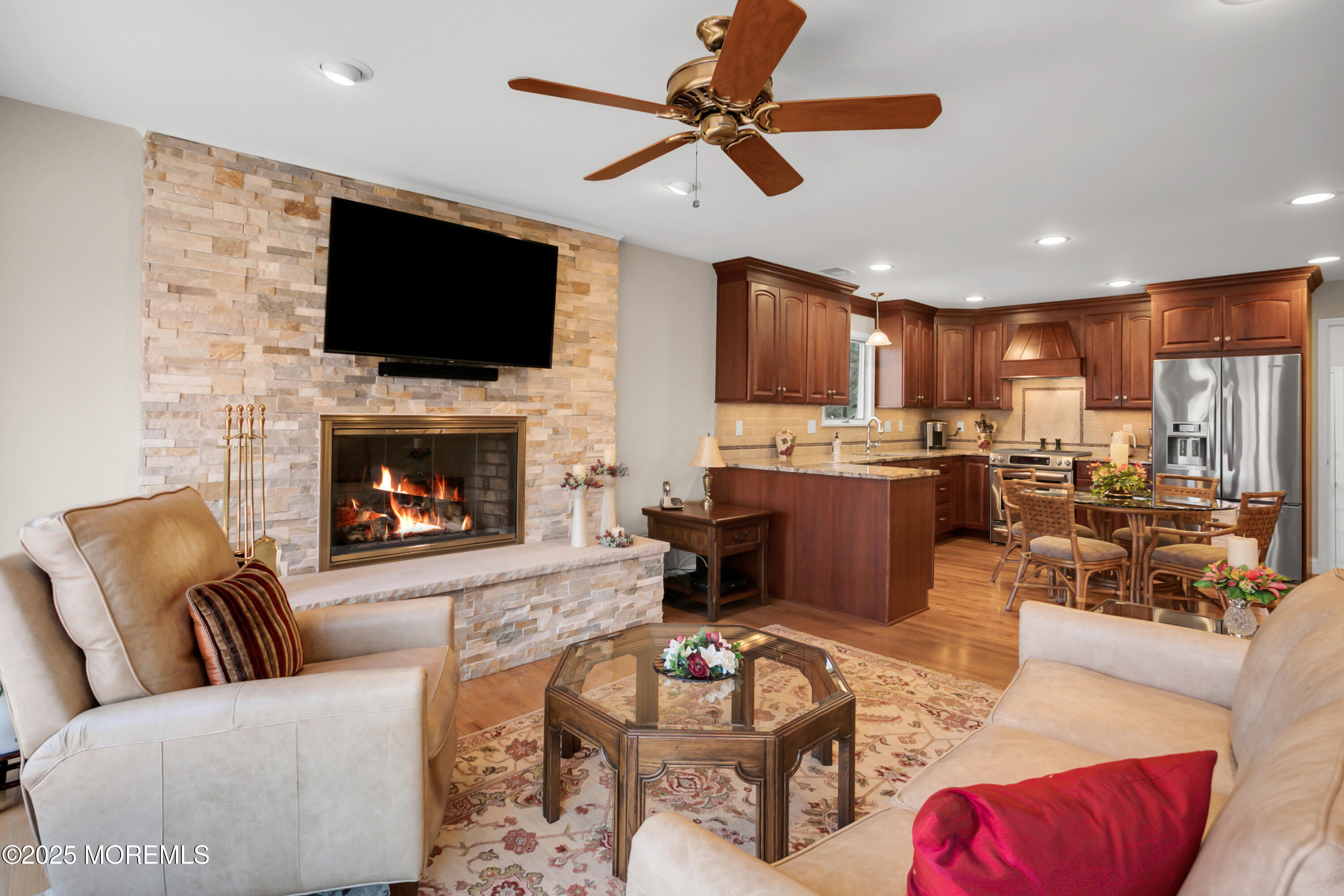 59 Doherty Drive Middletown, NJ 07748 - Photo 17 of 48 a living room with furniture fireplace and a flat screen tv