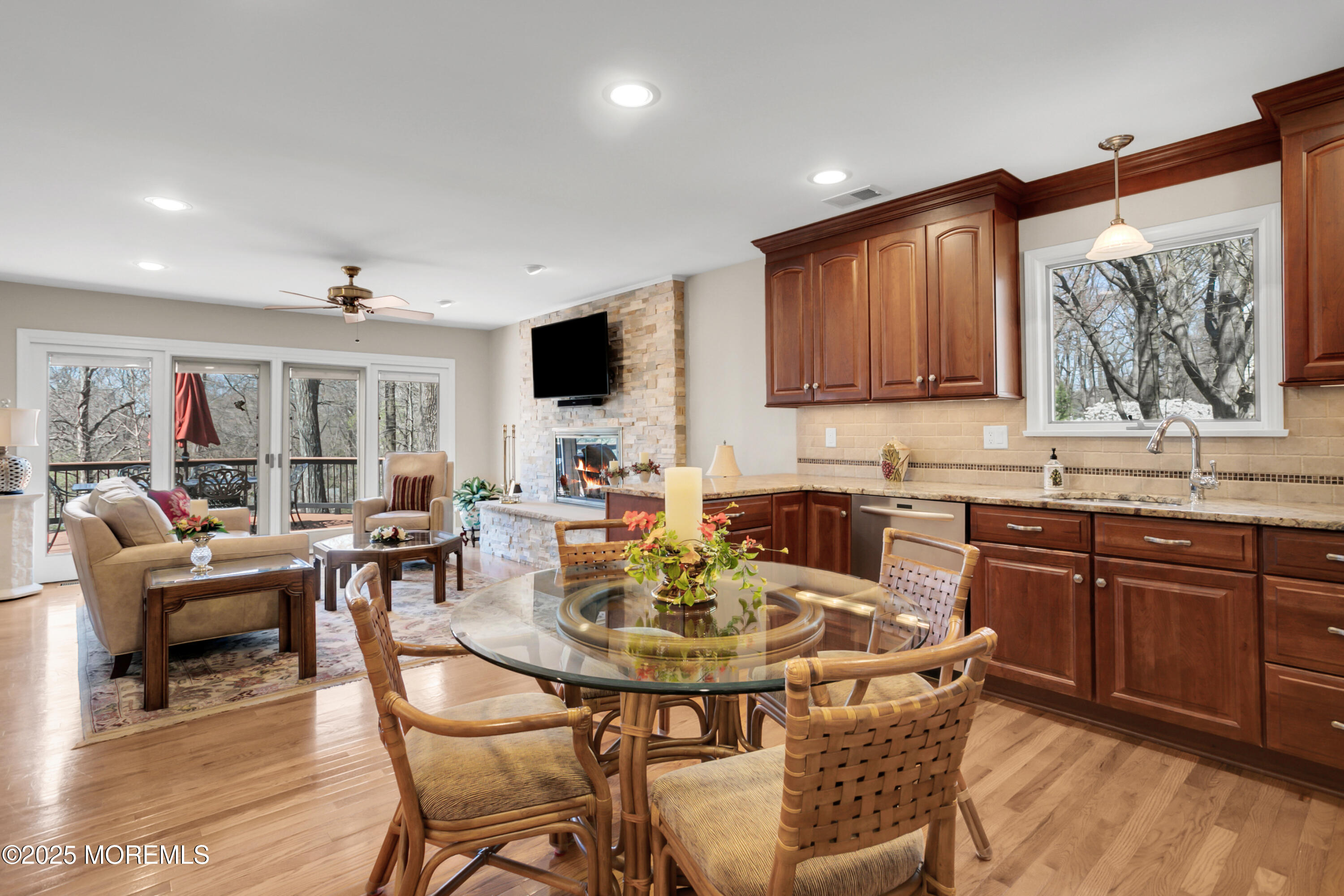 59 Doherty Drive Middletown, NJ 07748 - Photo 18 of 48 a kitchen with a stove a sink a dining table and chairs