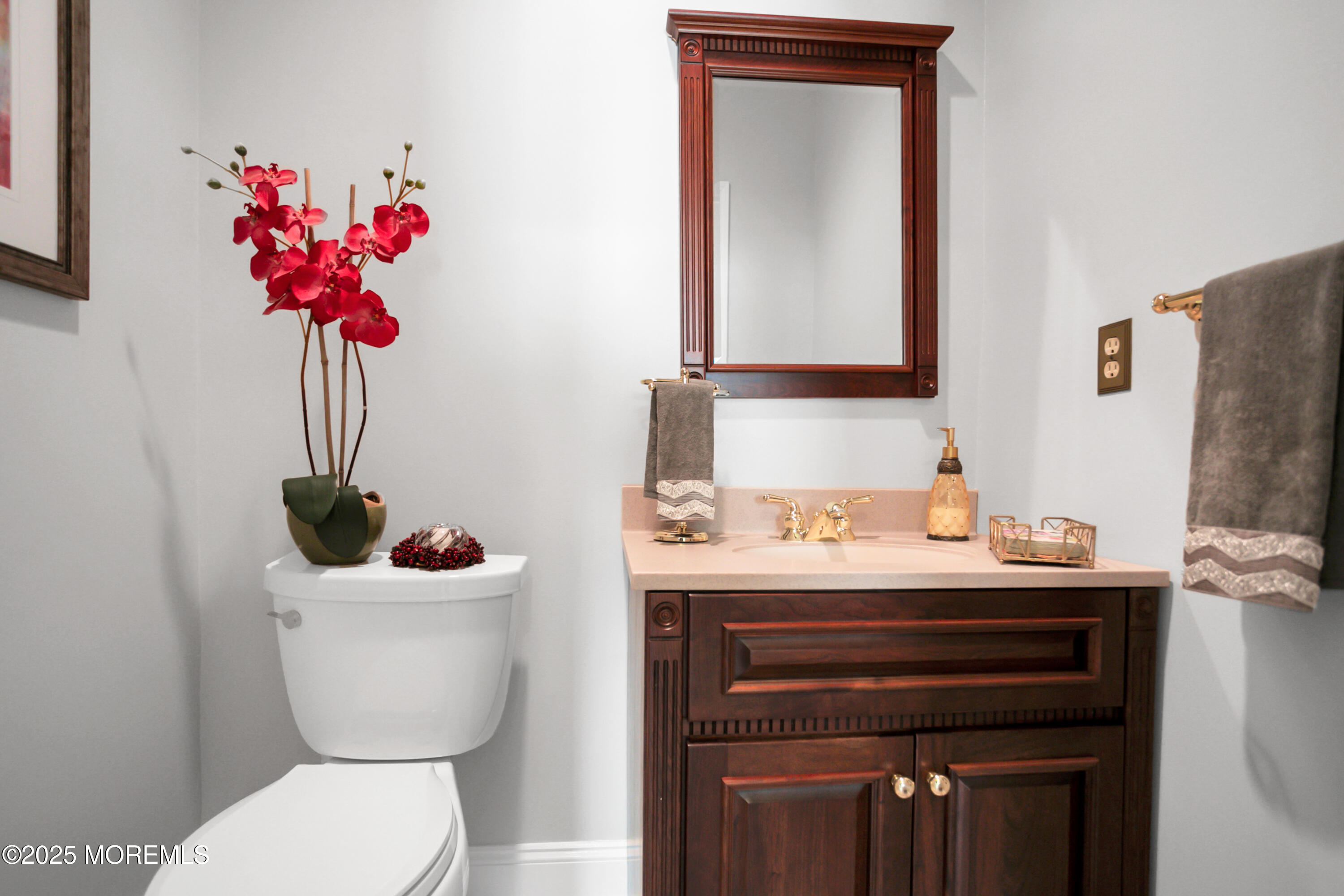 59 Doherty Drive Middletown, NJ 07748 - Photo 23 of 48 a bathroom with a toilet sink and mirror