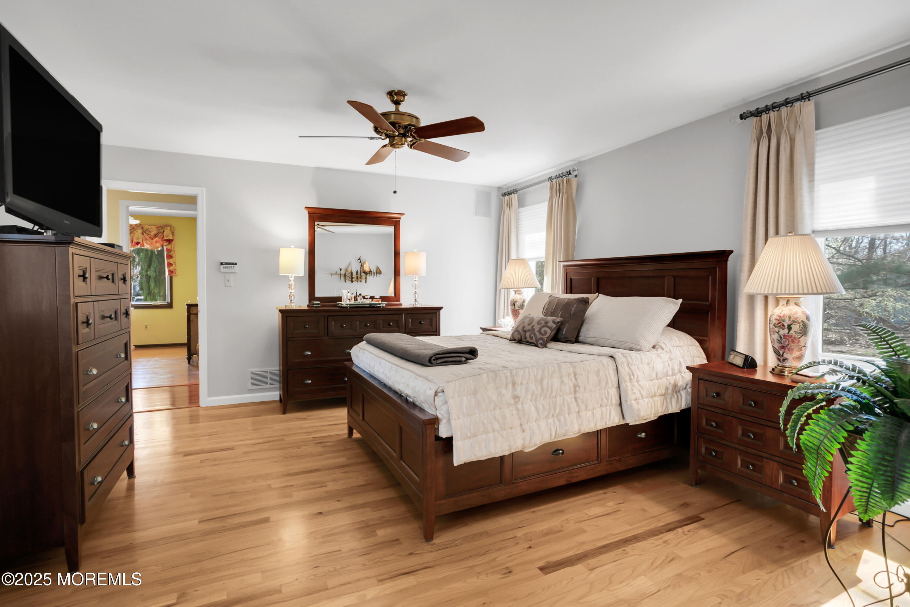 59 Doherty Drive Middletown, NJ 07748 - Photo 27 of 48 a bedroom with a bed a flat screen tv and dresser