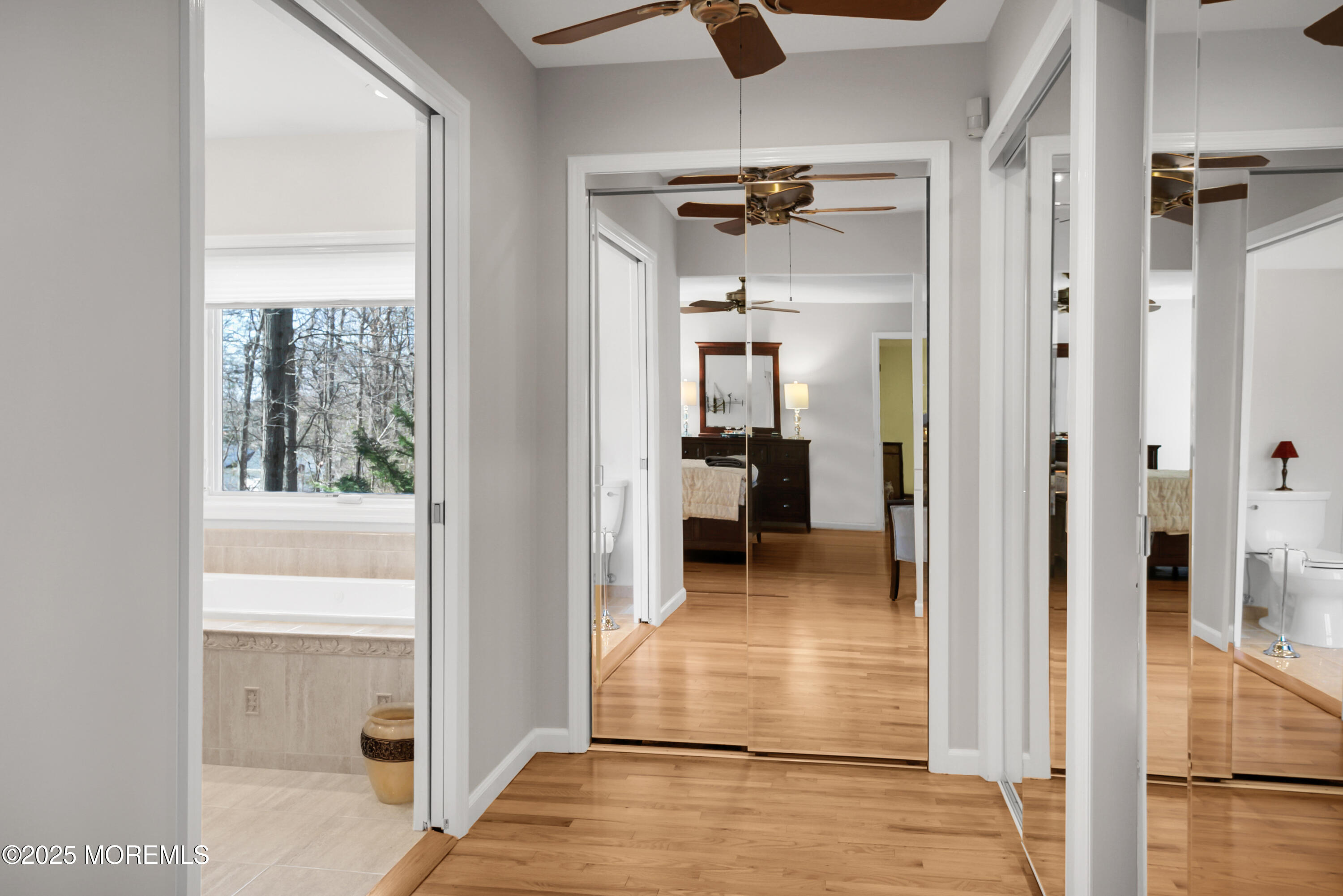59 Doherty Drive Middletown, NJ 07748 - Photo 28 of 48 a view of a hallway with a livingroom and a dinning room with wooden floor