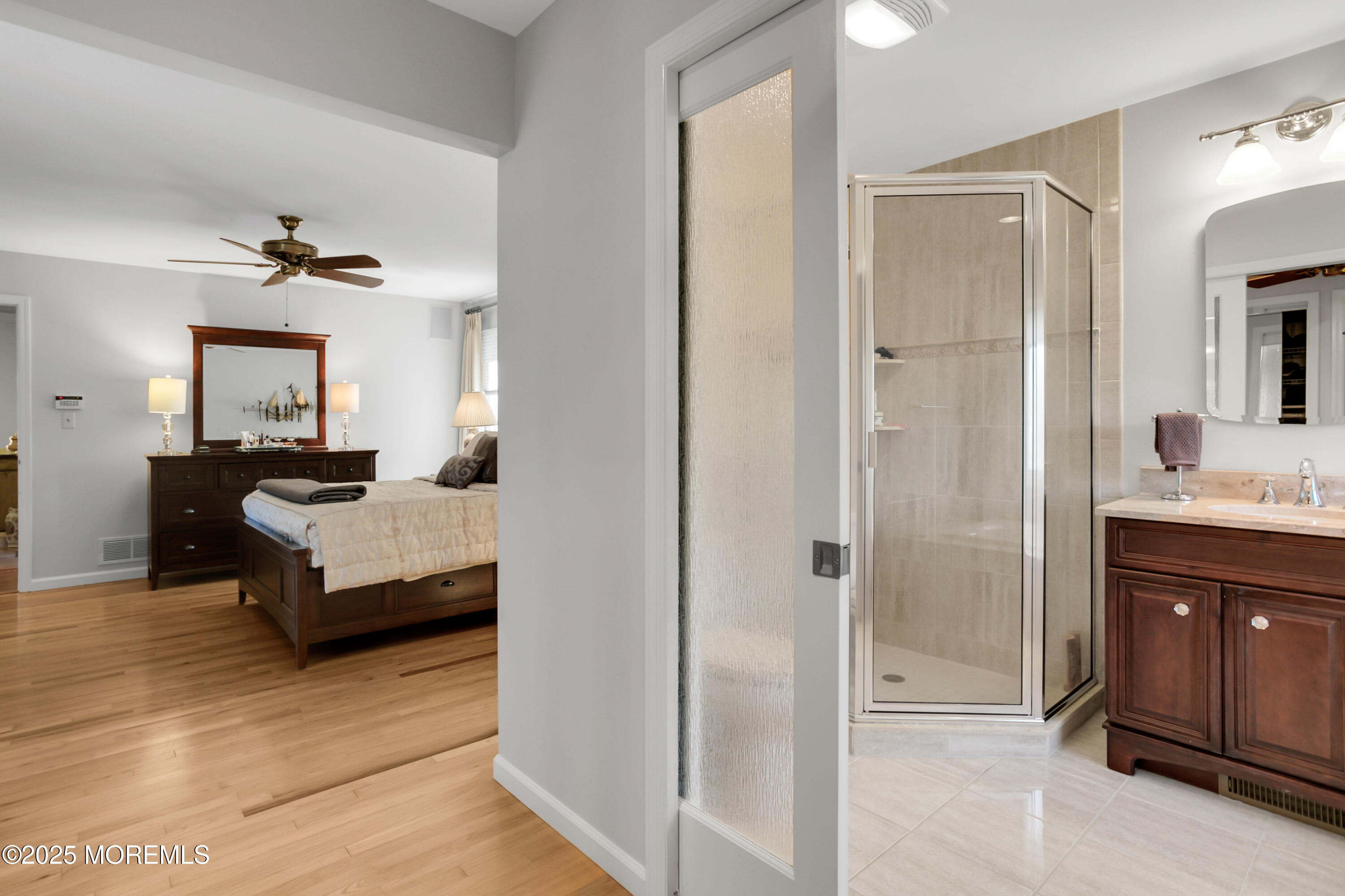 59 Doherty Drive Middletown, NJ 07748 - Photo 29 of 48 a spacious bedroom with a bed and a dresser
