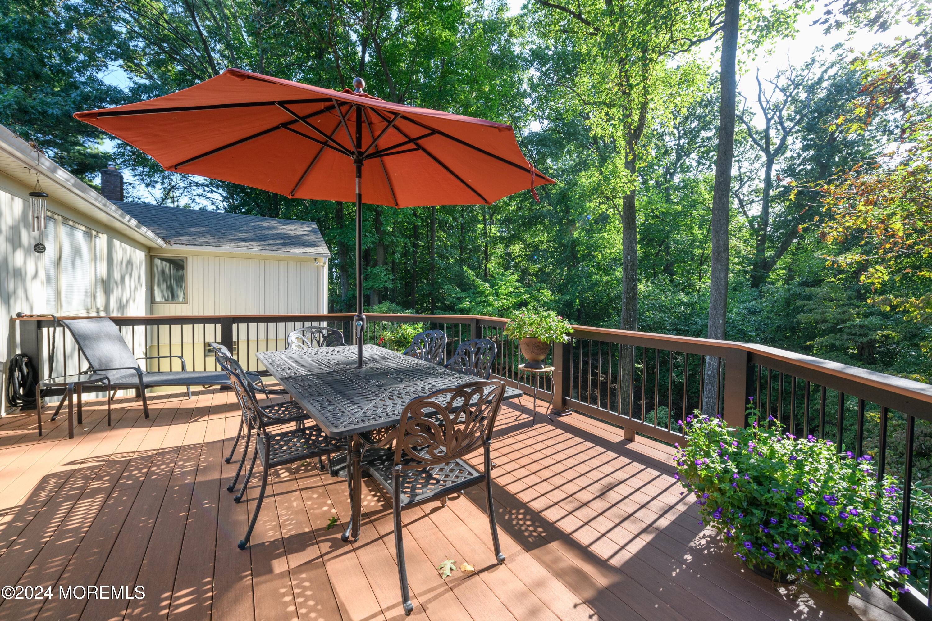 59 Doherty Drive Middletown, NJ 07748 - Photo 34 of 48 a view of balcony with outdoor seating and wooden floor