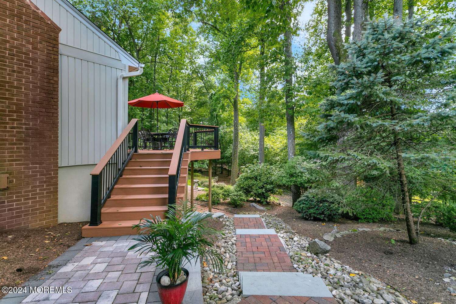 59 Doherty Drive Middletown, NJ 07748 - Photo 35 of 48 a backyard of a house with table and chairs