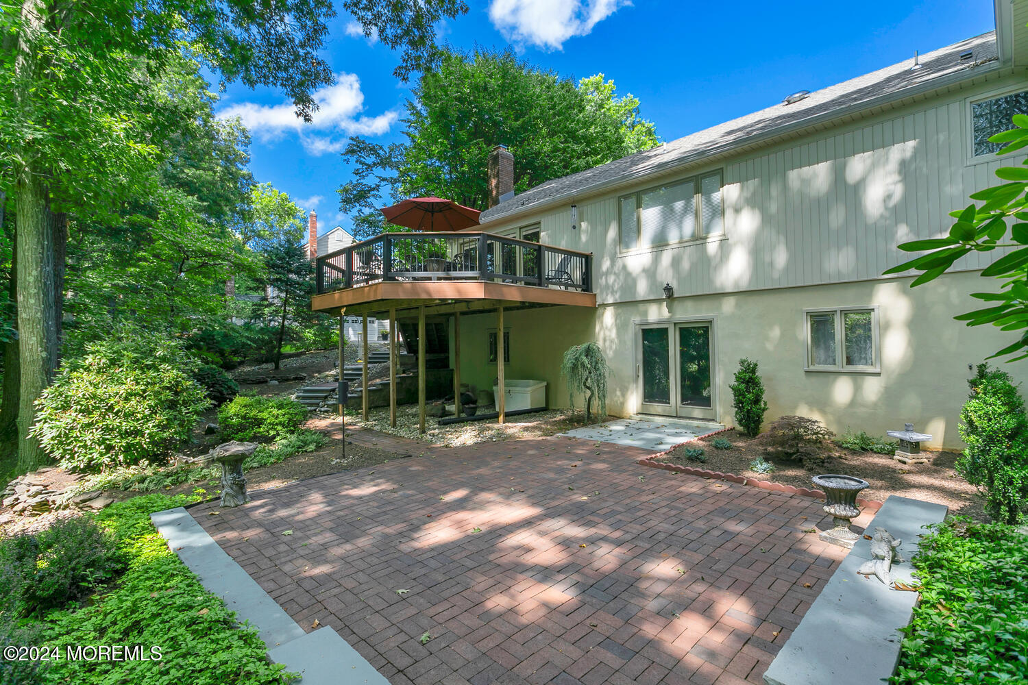 59 Doherty Drive Middletown, NJ 07748 - Photo 36 of 48 a front view of a house with garden and porch