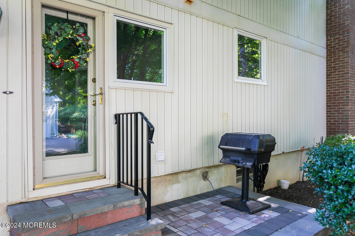 59 Doherty Drive Middletown, NJ 07748 - Photo 38 of 48 a view of porch with a potted plant and floor to ceiling windows