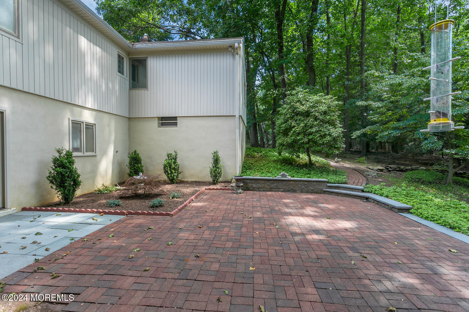 59 Doherty Drive Middletown, NJ 07748 - Photo 40 of 48 a backyard of a house with plants and trees