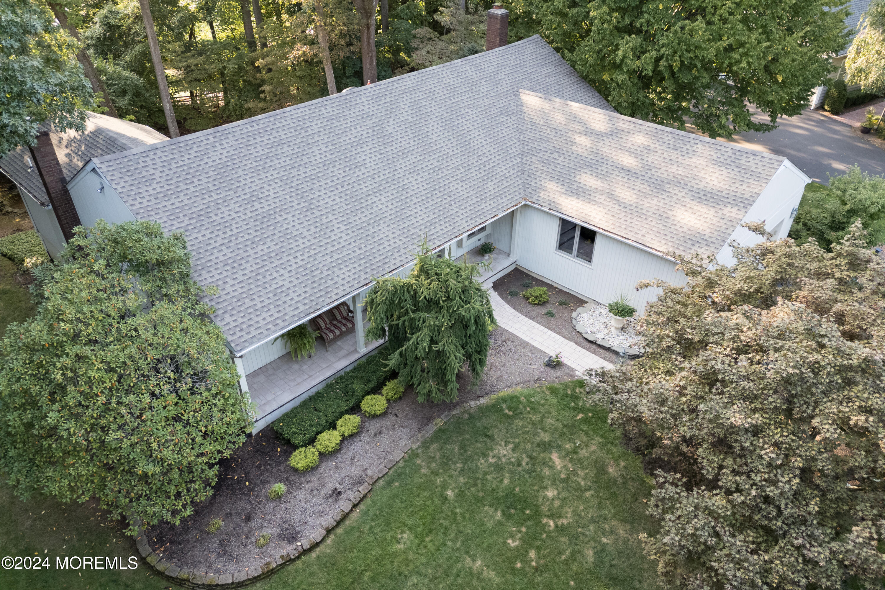 59 Doherty Drive Middletown, NJ 07748 - Photo 45 of 48 a aerial view of a house with a yard and large trees