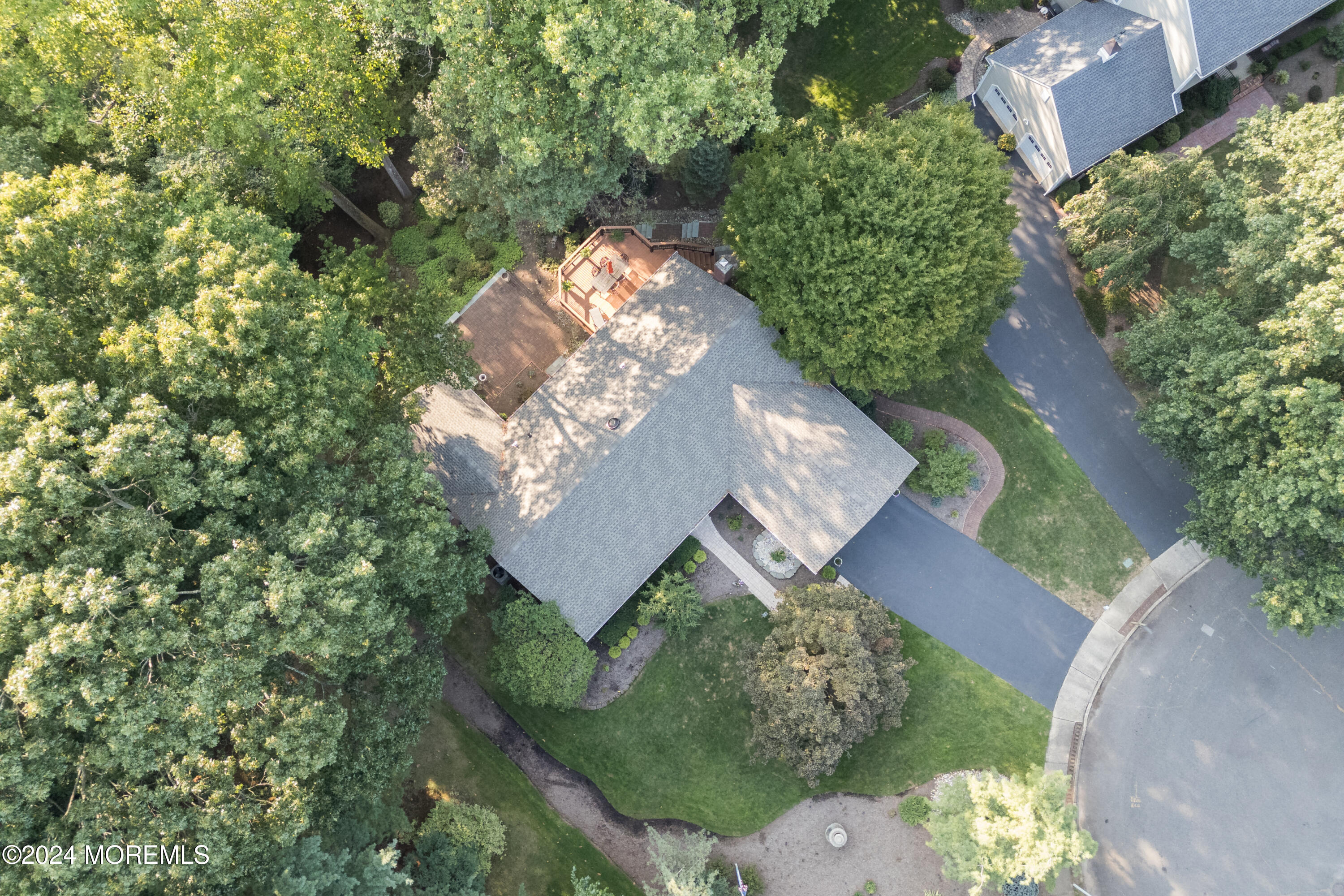 59 Doherty Drive Middletown, NJ 07748 - Photo 46 of 48 an aerial view of a house with a yard and large trees