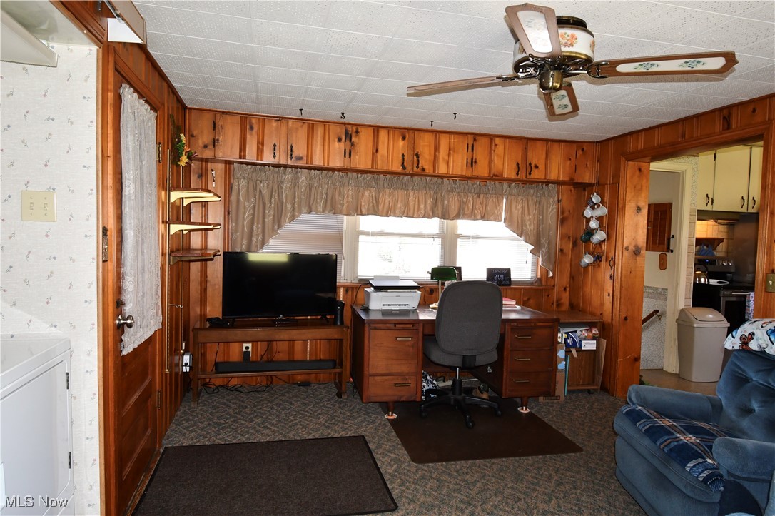 4659 Canfield Road Canfield, OH 44406 - Photo 15 of 34 Office area featuring wooden walls, a ceiling fan, and carpet