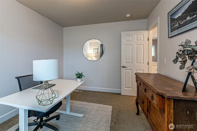 a workspace with furniture and window