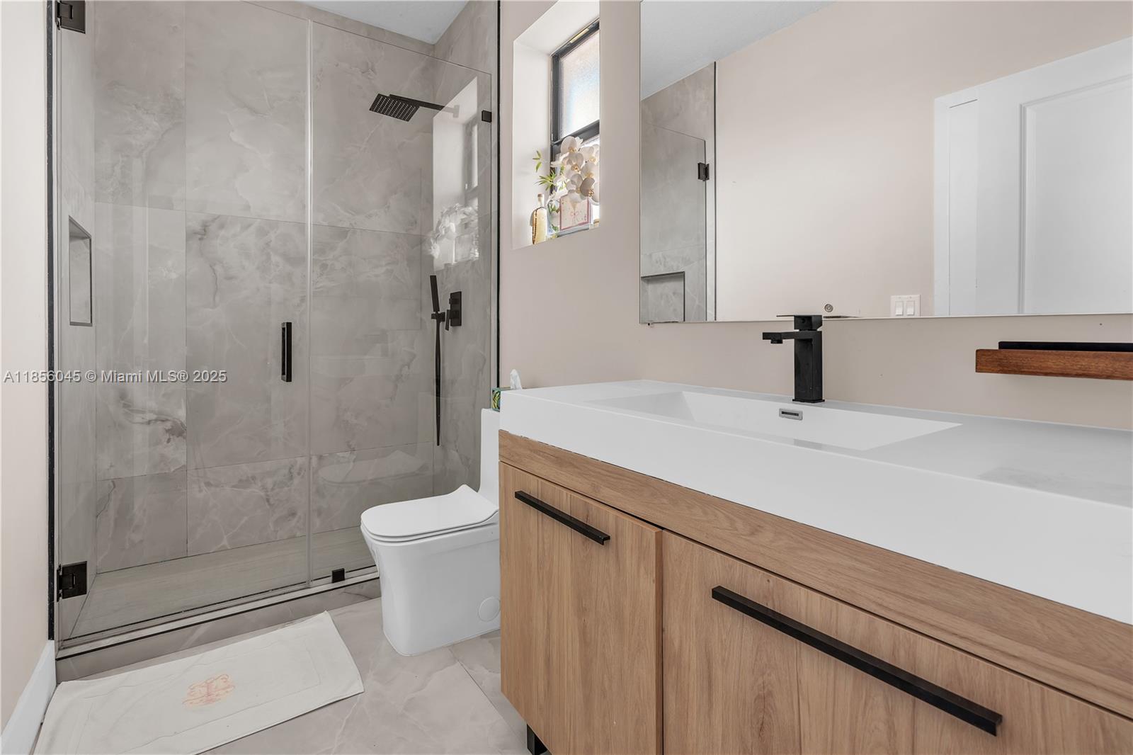 4335 Southwest 173rd Avenue Miramar, FL 33029 - Photo 23 of 59 a bathroom with a sink a toilet and shower