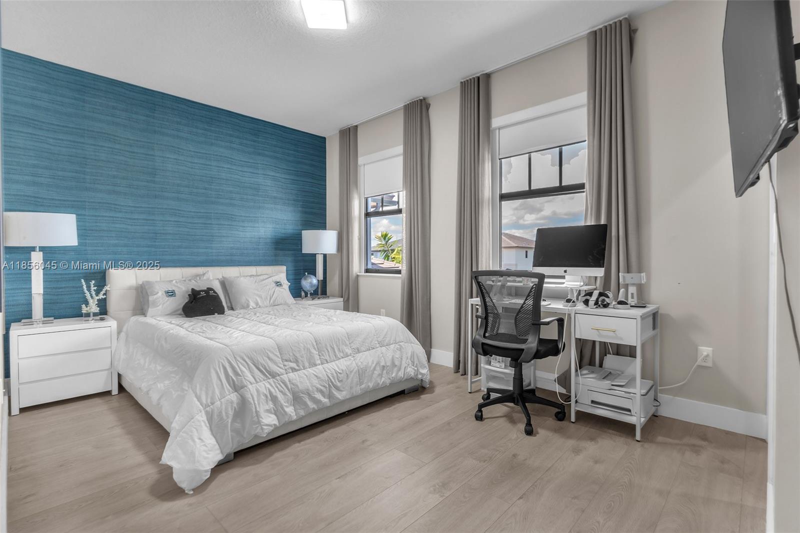 4335 Southwest 173rd Avenue Miramar, FL 33029 - Photo 25 of 59 a bedroom with a bed and a flat screen tv