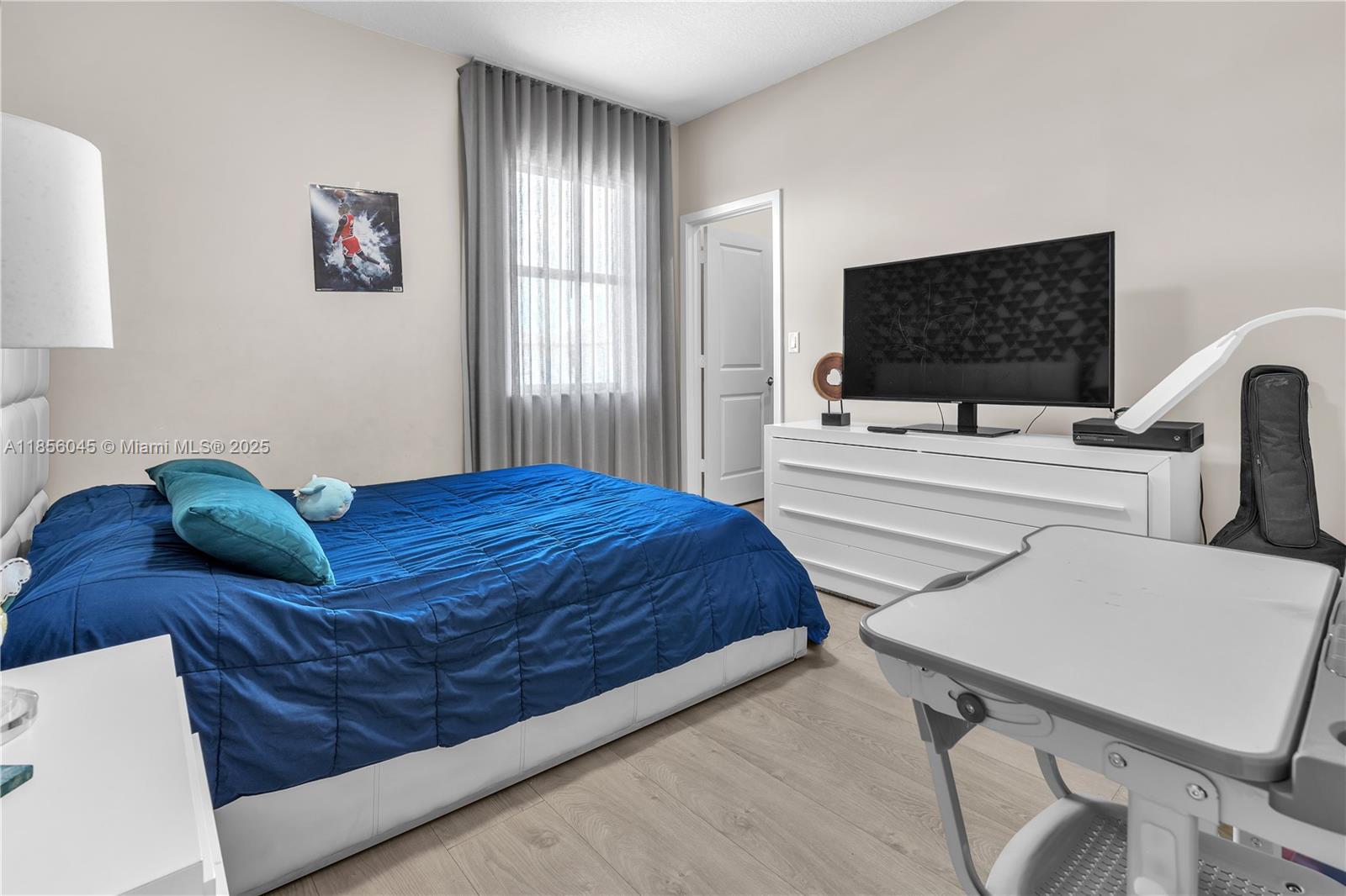 4335 Southwest 173rd Avenue Miramar, FL 33029 - Photo 26 of 59 a bedroom with a bed and a flat screen tv