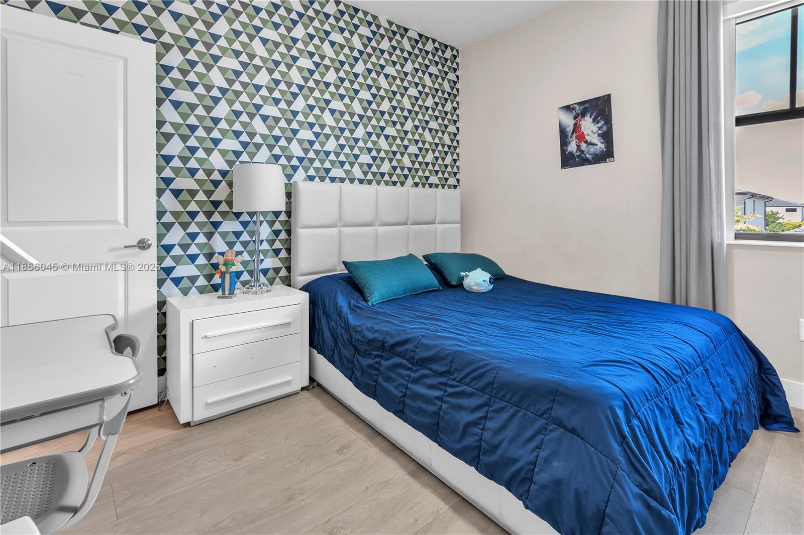 4335 Southwest 173rd Avenue Miramar, FL 33029 - Photo 27 of 59 a bedroom with a bed and a wall painting