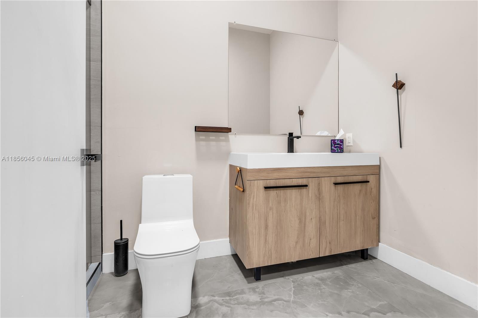 4335 Southwest 173rd Avenue Miramar, FL 33029 - Photo 33 of 59 a bathroom with a toilet a sink and mirror