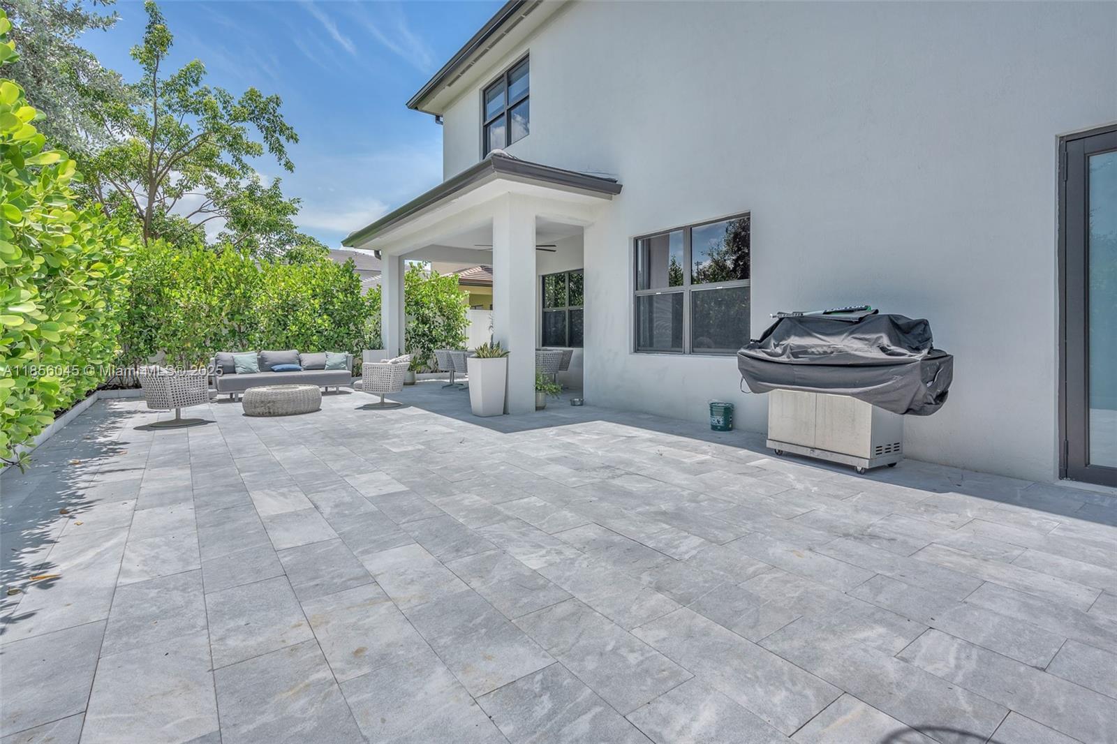 4335 Southwest 173rd Avenue Miramar, FL 33029 - Photo 36 of 59 a view of a house with porch and garden