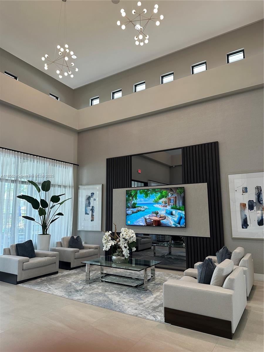 4335 Southwest 173rd Avenue Miramar, FL 33029 - Photo 48 of 59 a living room with furniture and a flat screen tv