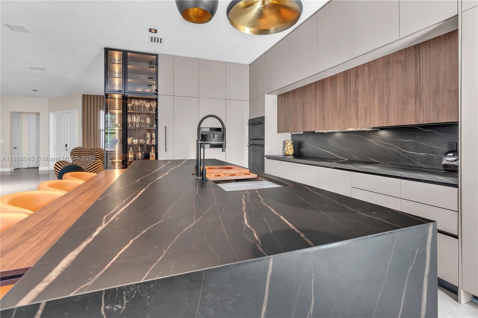 4335 Southwest 173rd Avenue Miramar, FL 33029 - Photo 6 of 59 a kitchen with a sink and a stove top oven