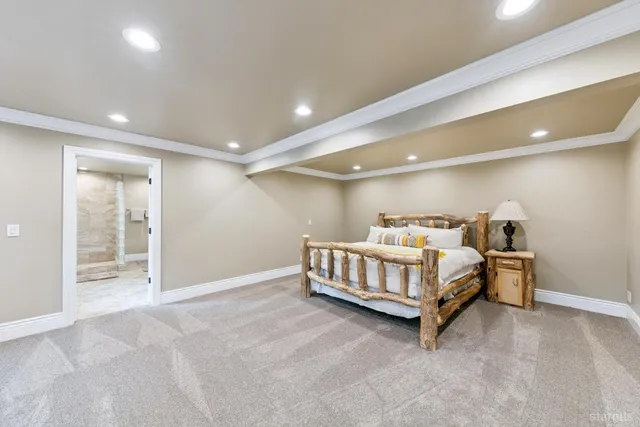 a bedroom with bed and a window