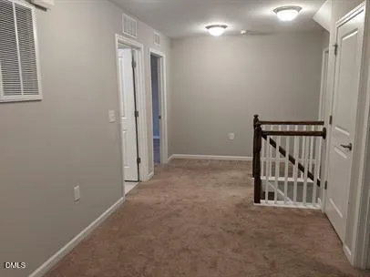a view of a hallway with staircase
