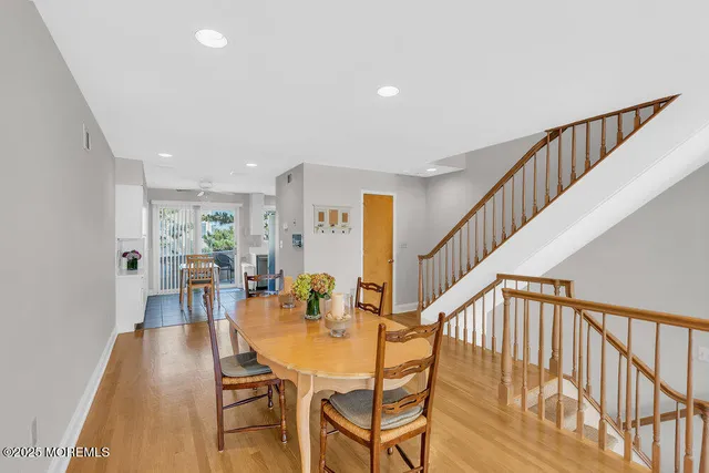 a kitchen with a refrigerator stove and white cabinets