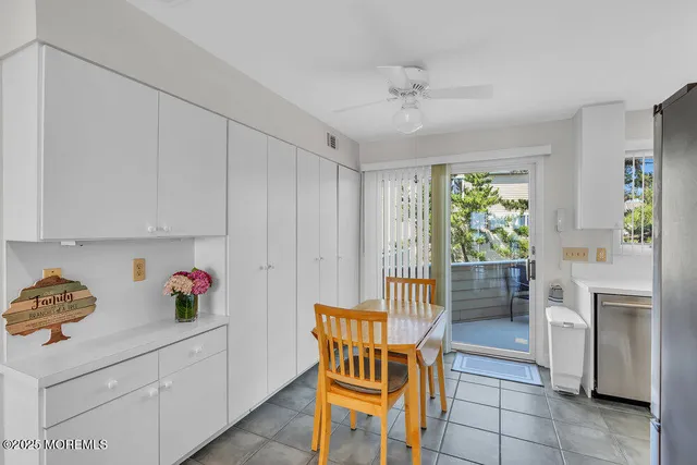 a view of a chairs and table in the balcony