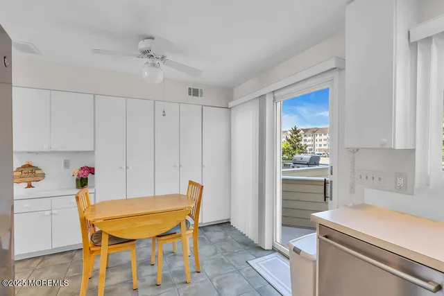 a bathroom with a sink a toilet and a large mirror