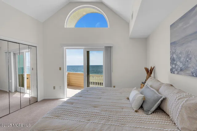 a bathroom with a sink vanity mirror and toilet