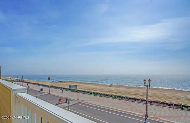 a bedroom with a bed and glass door