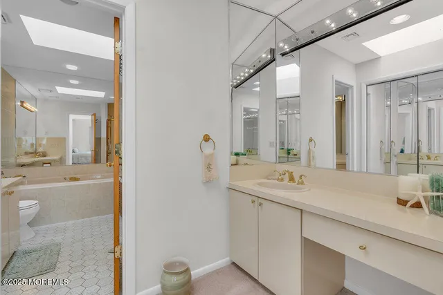 a bedroom with a bed and a table in it