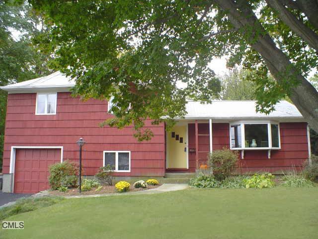 131 Farist Road Fairfield, CT 06825 - Photo 1 of 1 a front view of a house with garden