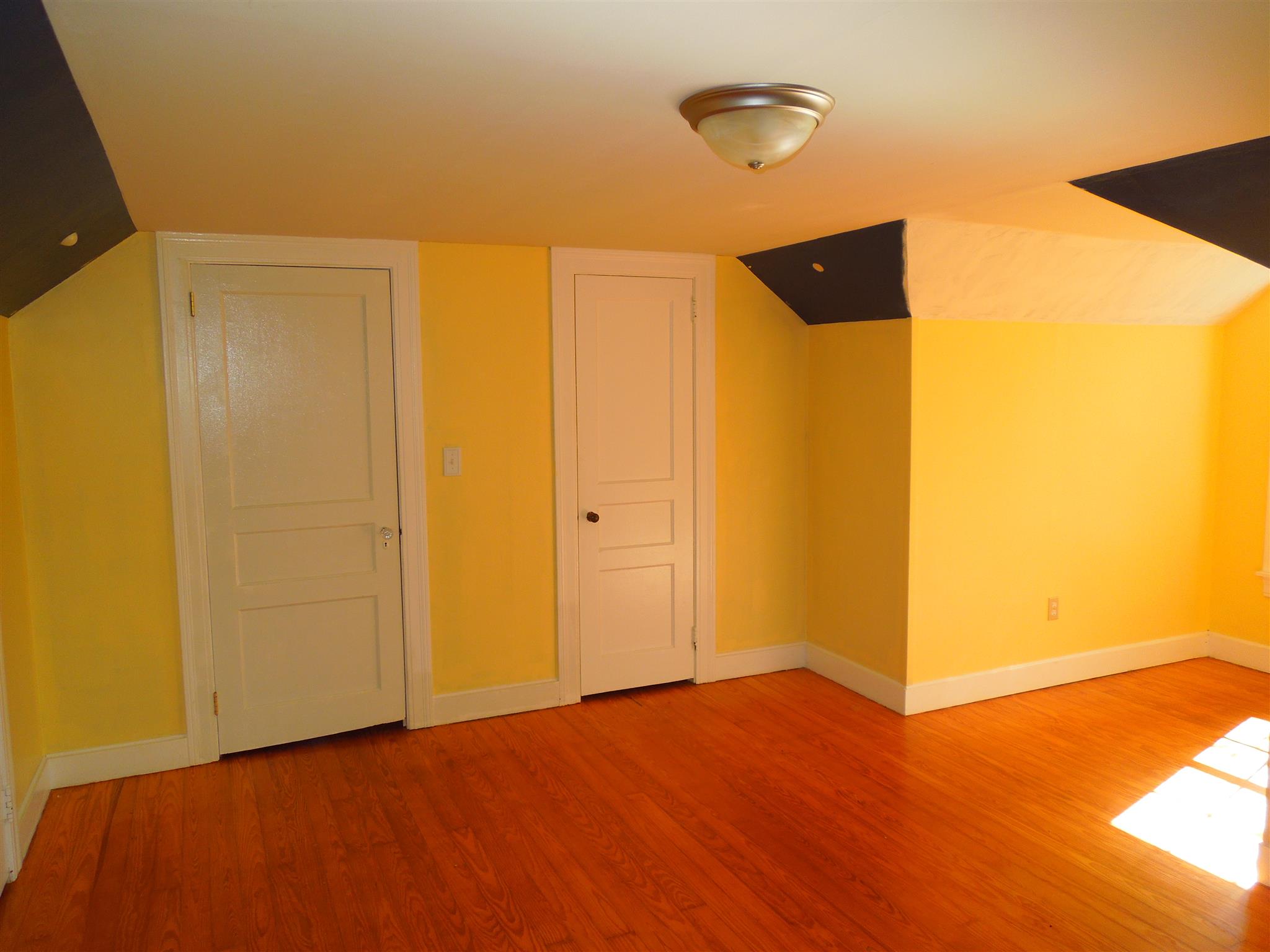 336 Pulaski Street Lawrenceburg, TN 38464 - Photo 15 of 20 a view of an empty room with wooden floor and a window