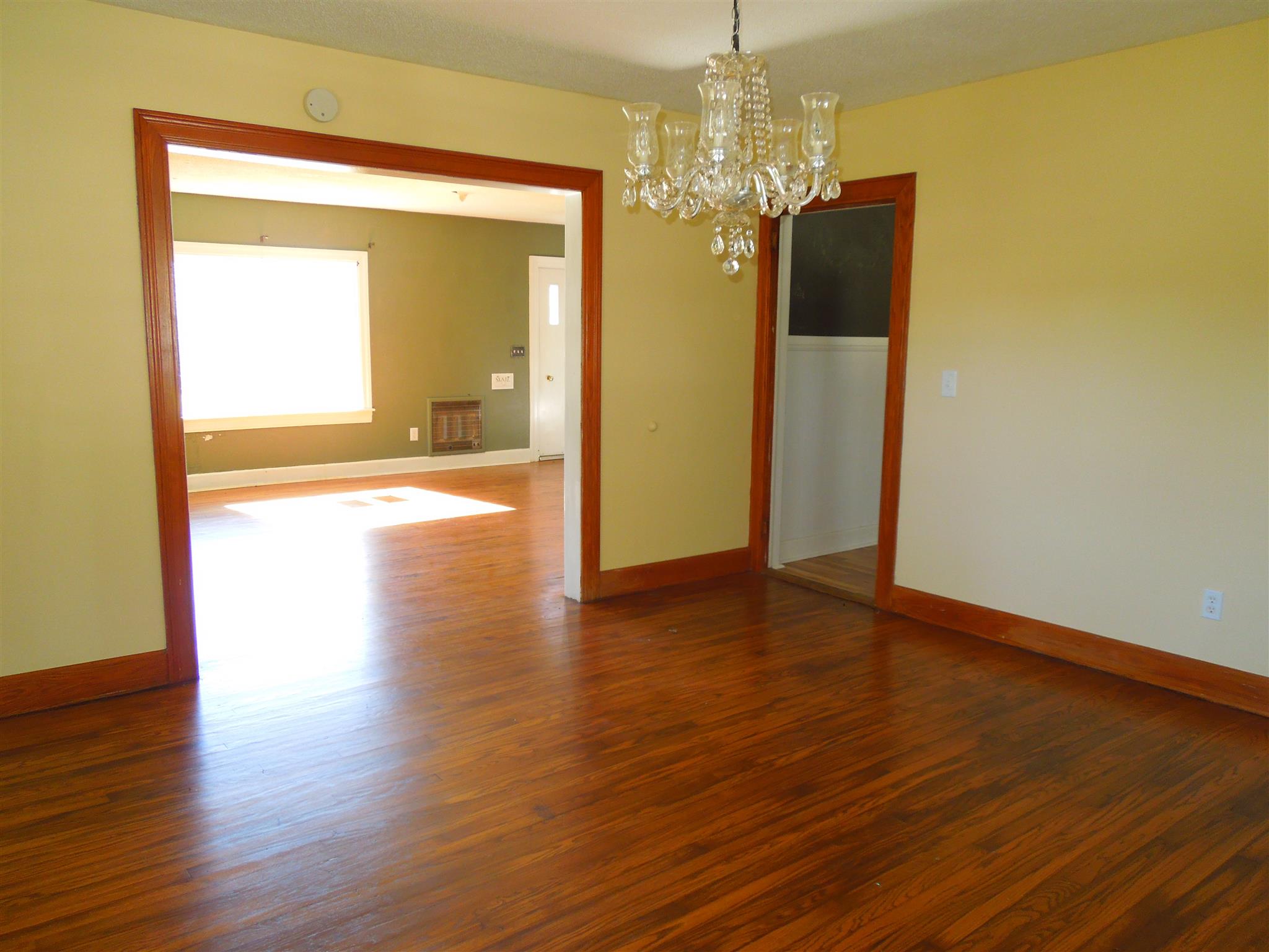 336 Pulaski Street Lawrenceburg, TN 38464 - Photo 4 of 20 a view of a big room with wooden floor chandelier and livingroom