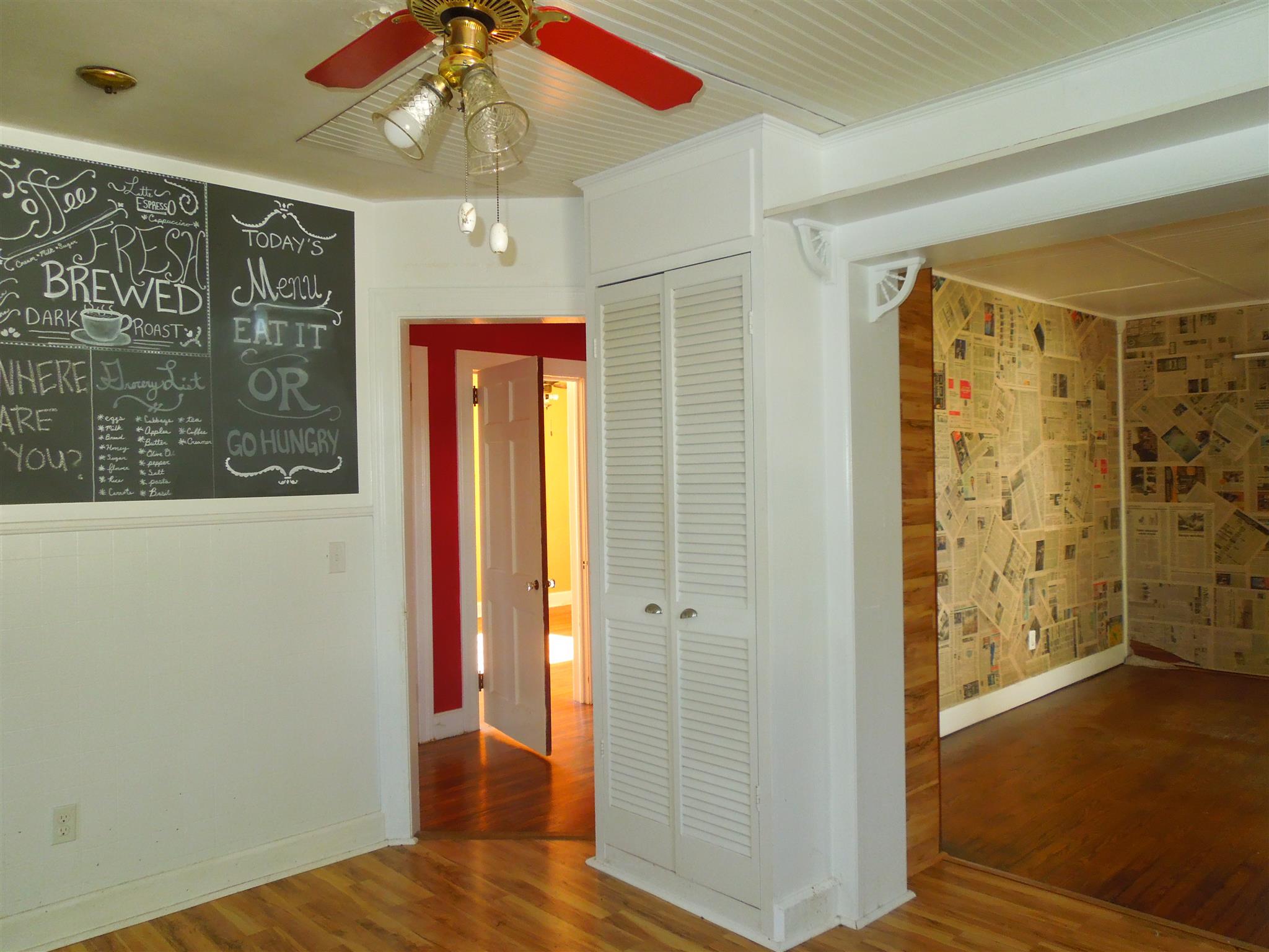 336 Pulaski Street Lawrenceburg, TN 38464 - Photo 7 of 20 a view of a hallway with a door and wooden floor