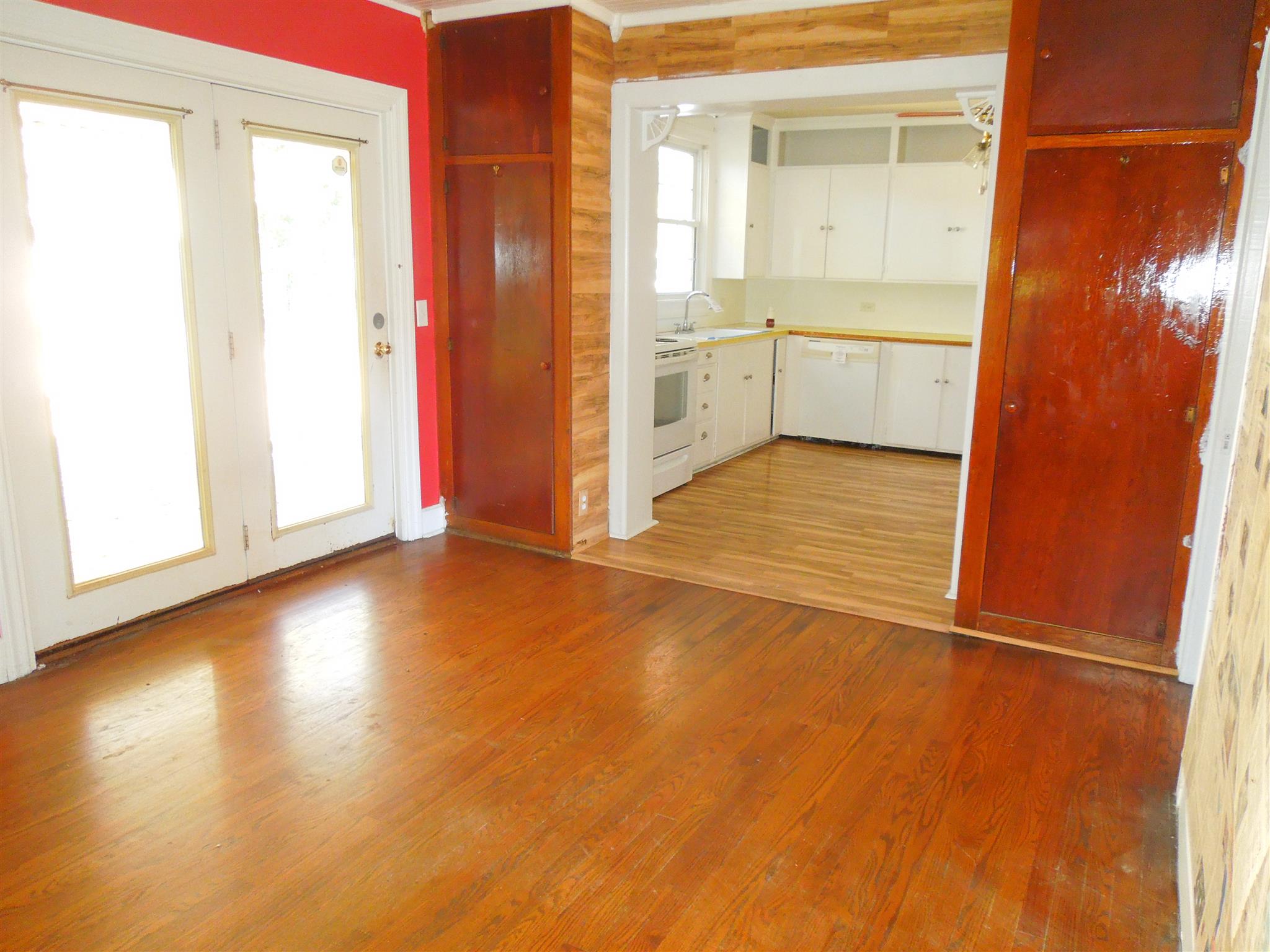 336 Pulaski Street Lawrenceburg, TN 38464 - Photo 8 of 20 a view of an empty room with window and wooden floor