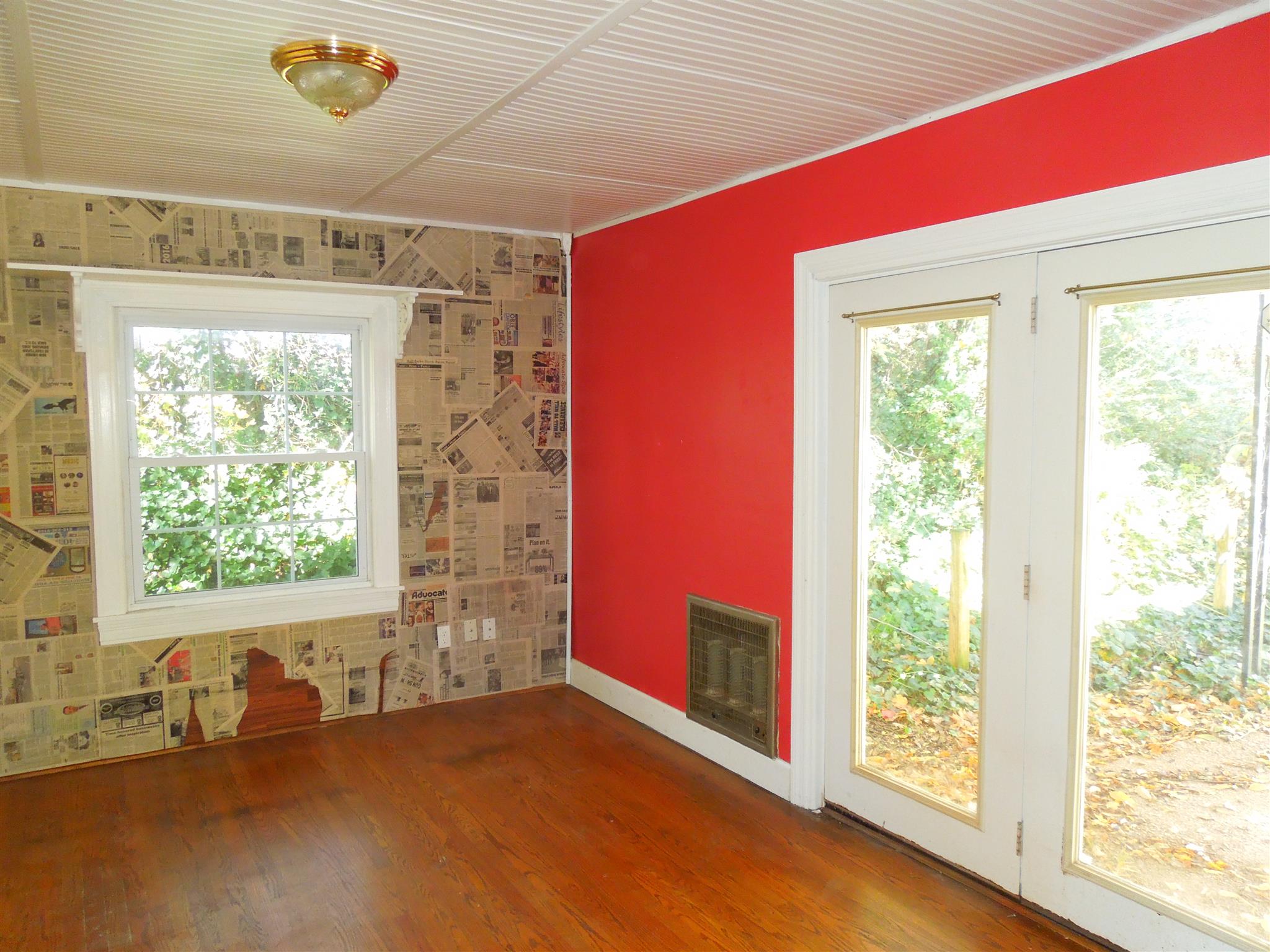 336 Pulaski Street Lawrenceburg, TN 38464 - Photo 9 of 20 a view of empty room with wooden floor and fan