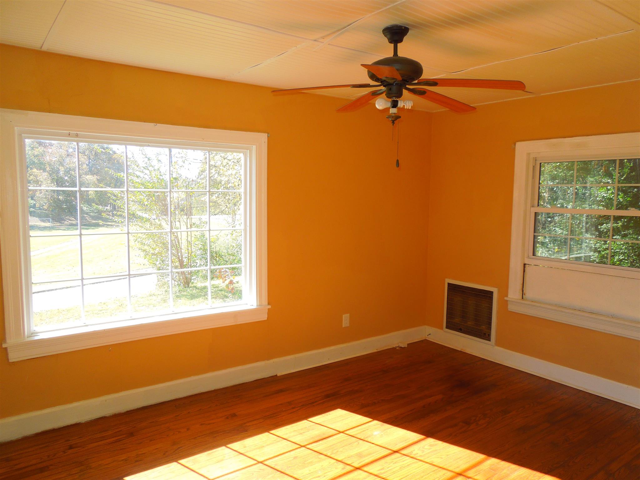 336 Pulaski Street Lawrenceburg, TN 38464 - Photo 10 of 20 a view of empty room with wooden floor and fan