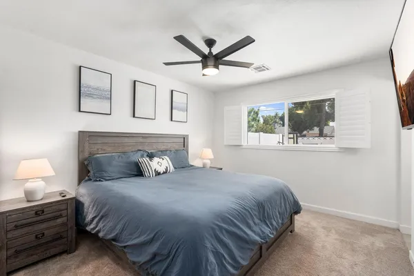 a bedroom with a bed and window