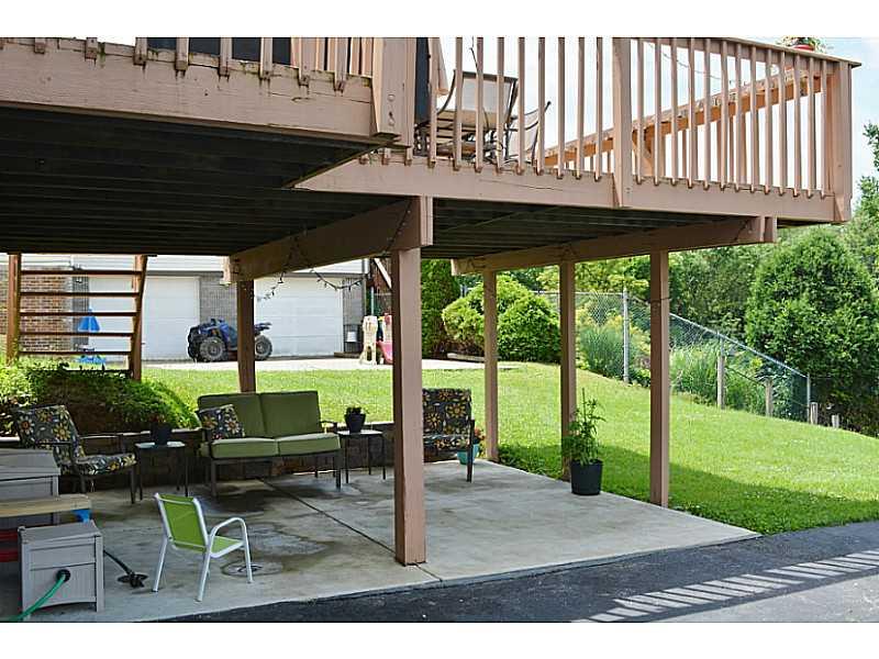 109 Phillips Lane McKees Rocks, PA 15136 - Photo 23 of 25 Patio/Deck. Additional outdoor space for relaxing on concrete patio beneath deck.